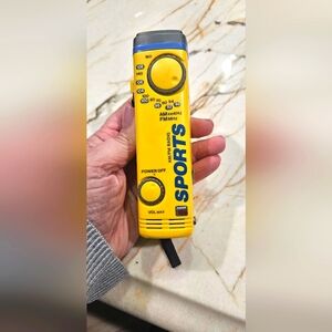 90s Vintage portable AM/FM radio yellow, clip on, antenna